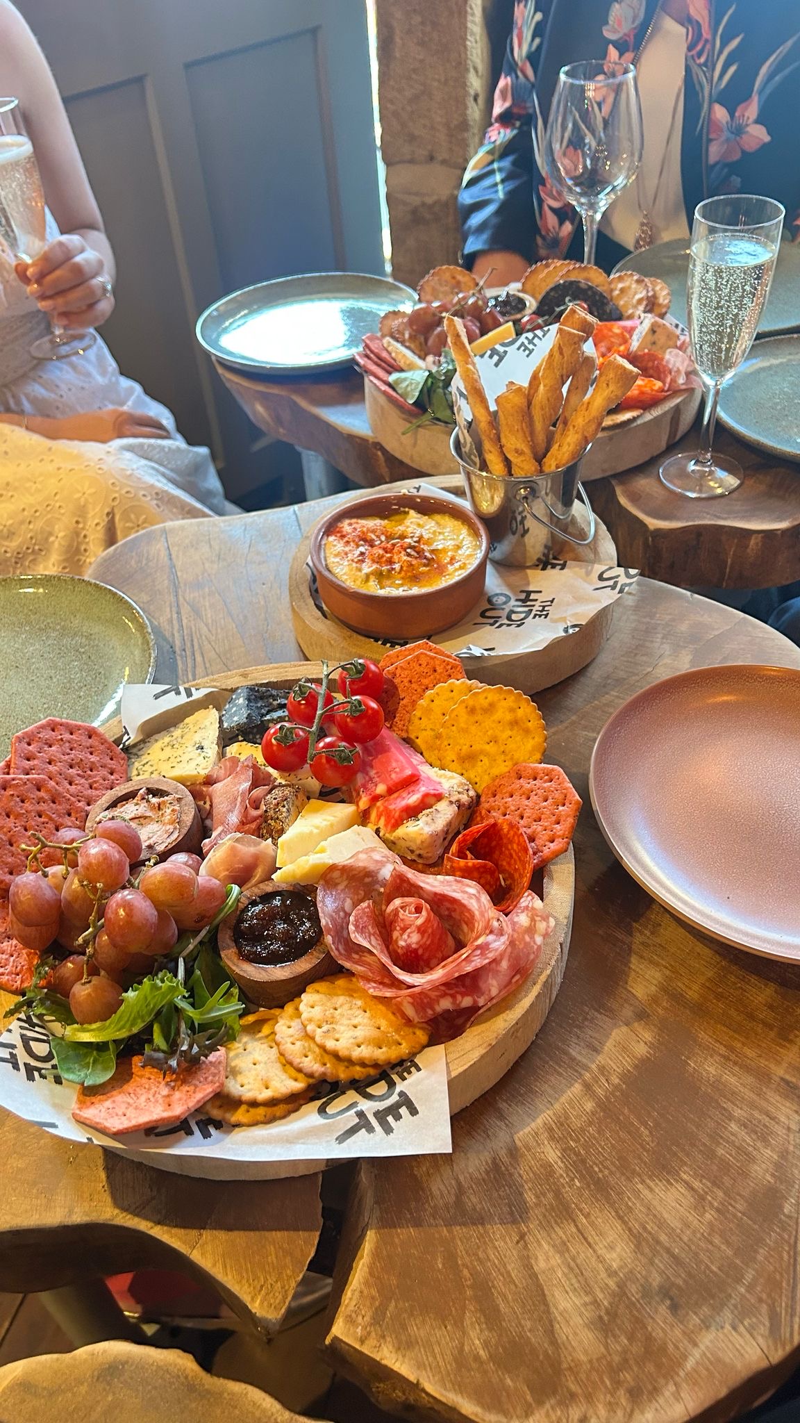 Sharing boards and Prosecco for a celebration